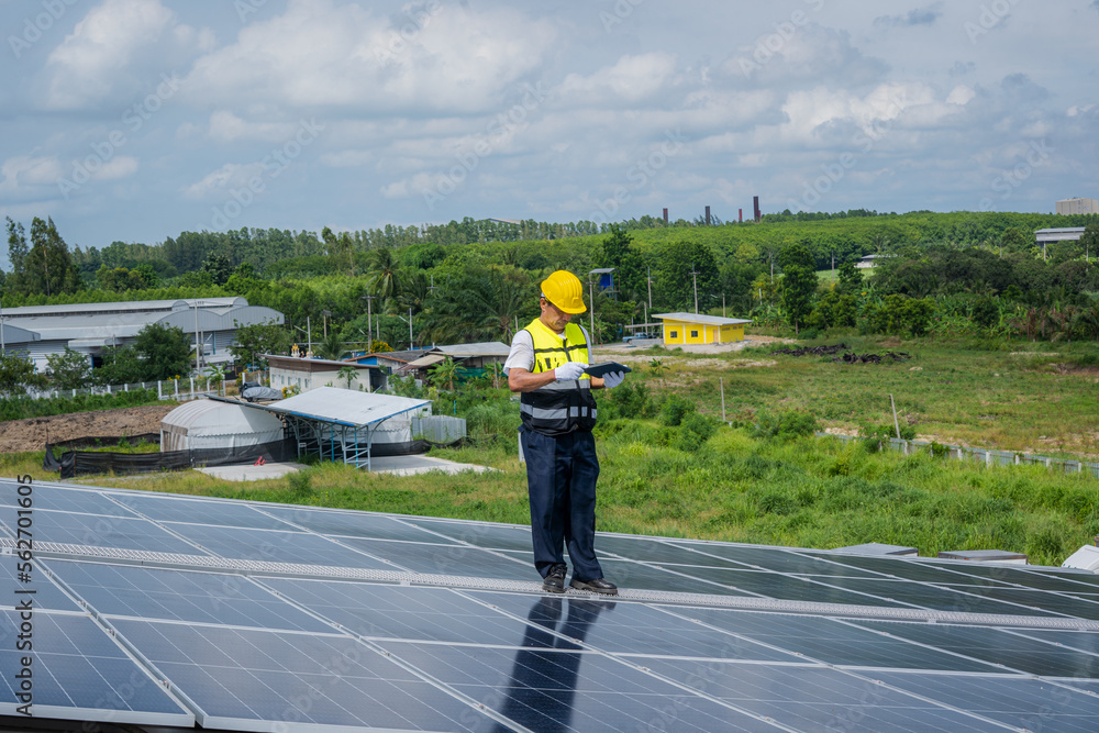 Technician installing the solar panels at roof top,Technician checking Solar panel.