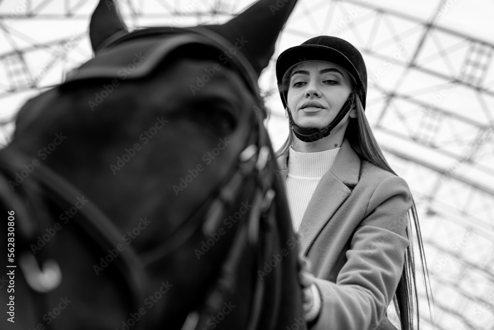 Pretty jockey practice horseriding. Young lady learning to ride at the ranch.