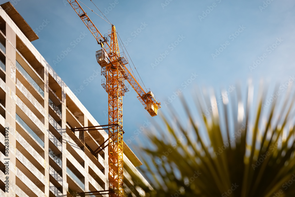 Construction site. Skyscrapper building and cranes.