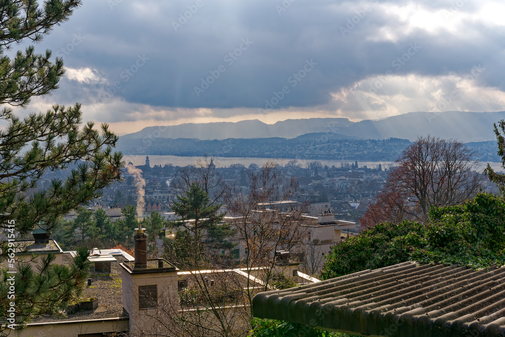 Aerial view of City of Zürich with church and lake in the background on a blue cloudy autumn day. Ph