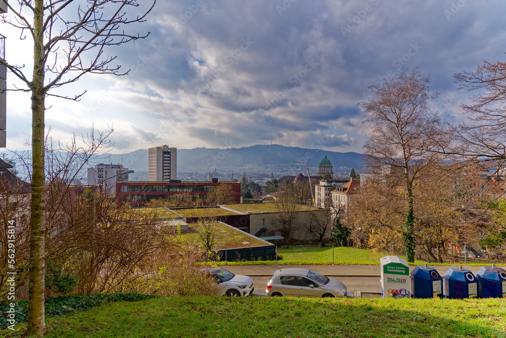 Aerial view of City of Zürich with tower of University and local mountain Uetliberg in the backgroun