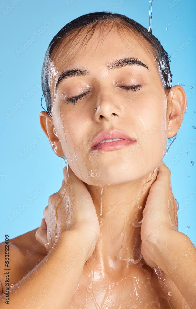 Woman, shower water and face of a calm model ready for morning skincare and wellness. Blue backgroun