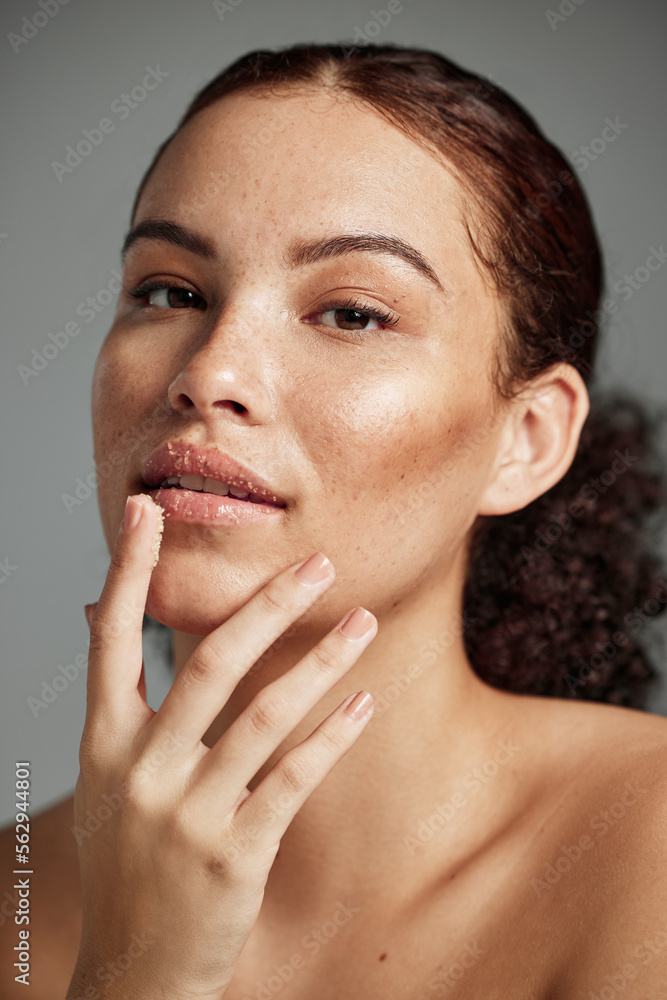 Face, sugar scrub and lips of woman in studio isolated on a gray background. Portrait, cosmetics and