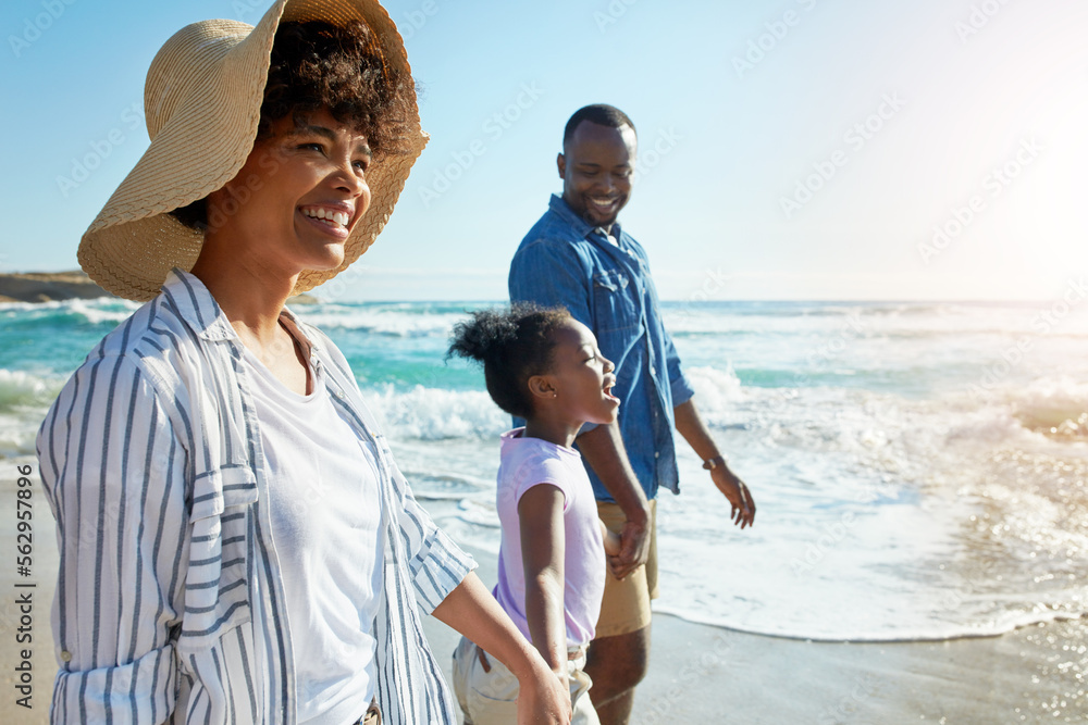 Happy family, summer and beach walk by parents and child on vacation or holiday at the ocean or sea.