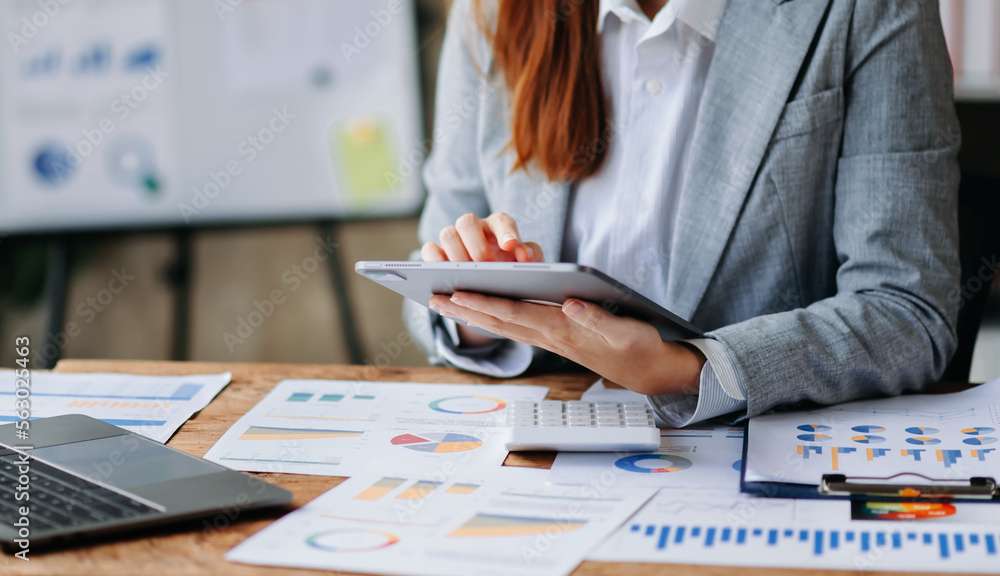 businesswoman hand using smart phone, tablet payments and holding credit card online shopping, omni 