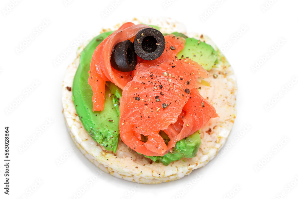 Rice Cake Sandwich with Fresh Salmon, Avocado and Olives - Isolated on White. Easy Breakfast. Diet F