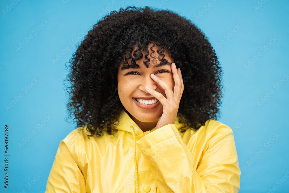 Portrait, laugh and funny with a black woman on a blue background, laughing at a joke in studio. Fac