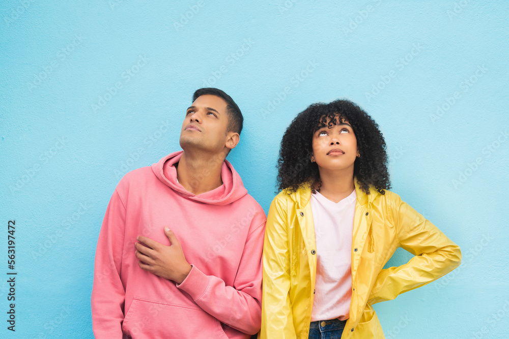 Thinking, mockup and fashion with a black couple on a blue background in studio branding or product 