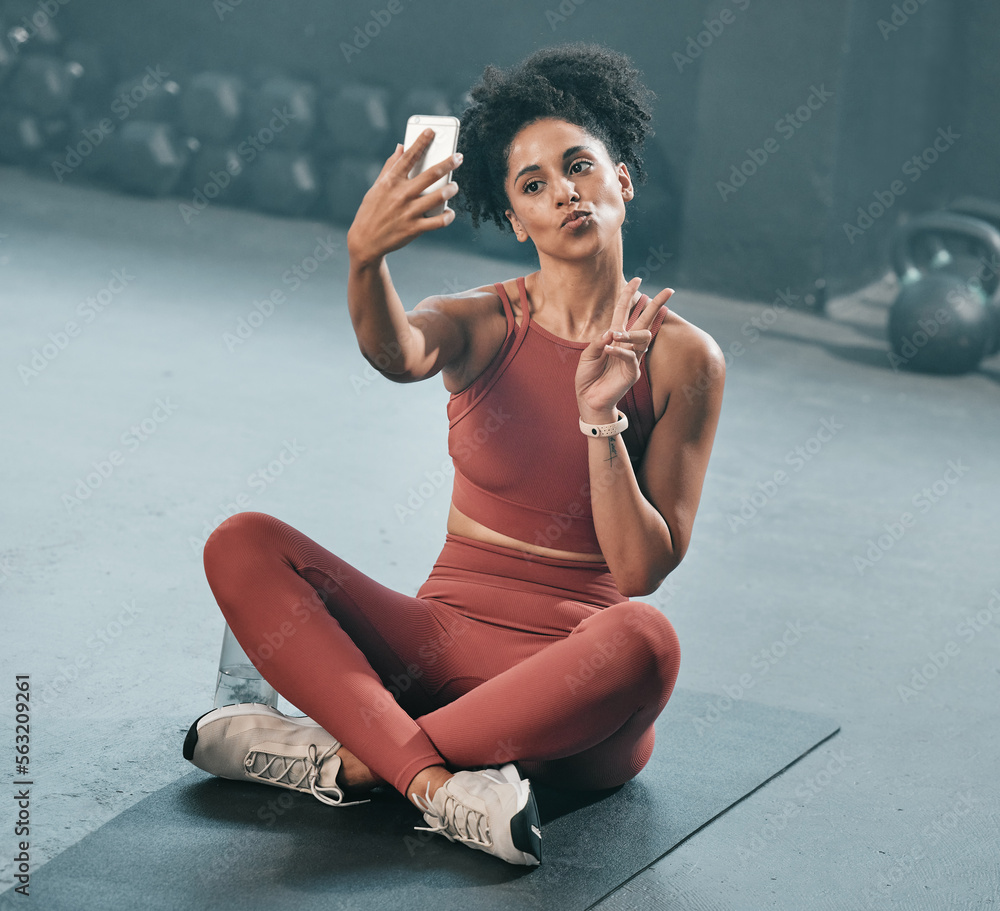 Fitness, selfie and woman on a gym floor with phone, peace and hand sign before exercise routine. Wo