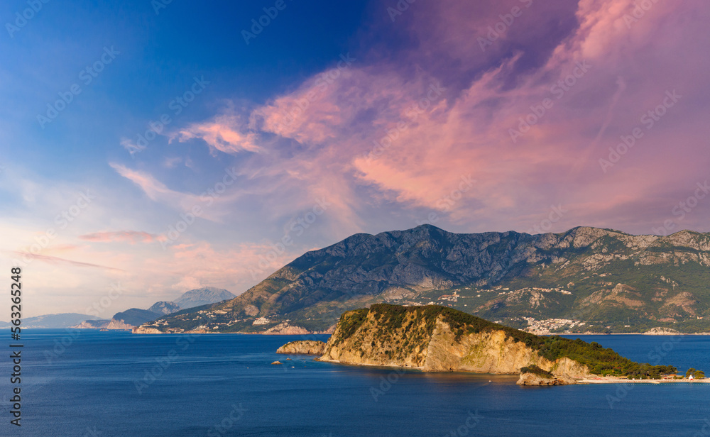 Island of St. Nicholas with vegetation on shores in the Adriatic Sea against the backdrop of coastal