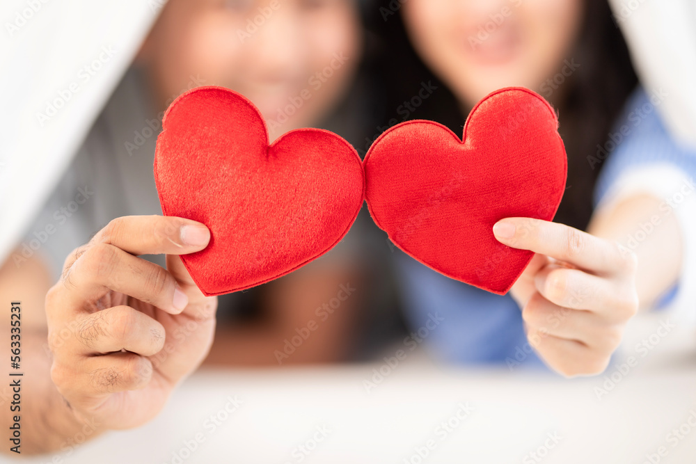 Asian couple Showing love surprise giving flowers or gifts to each other on important occasions such