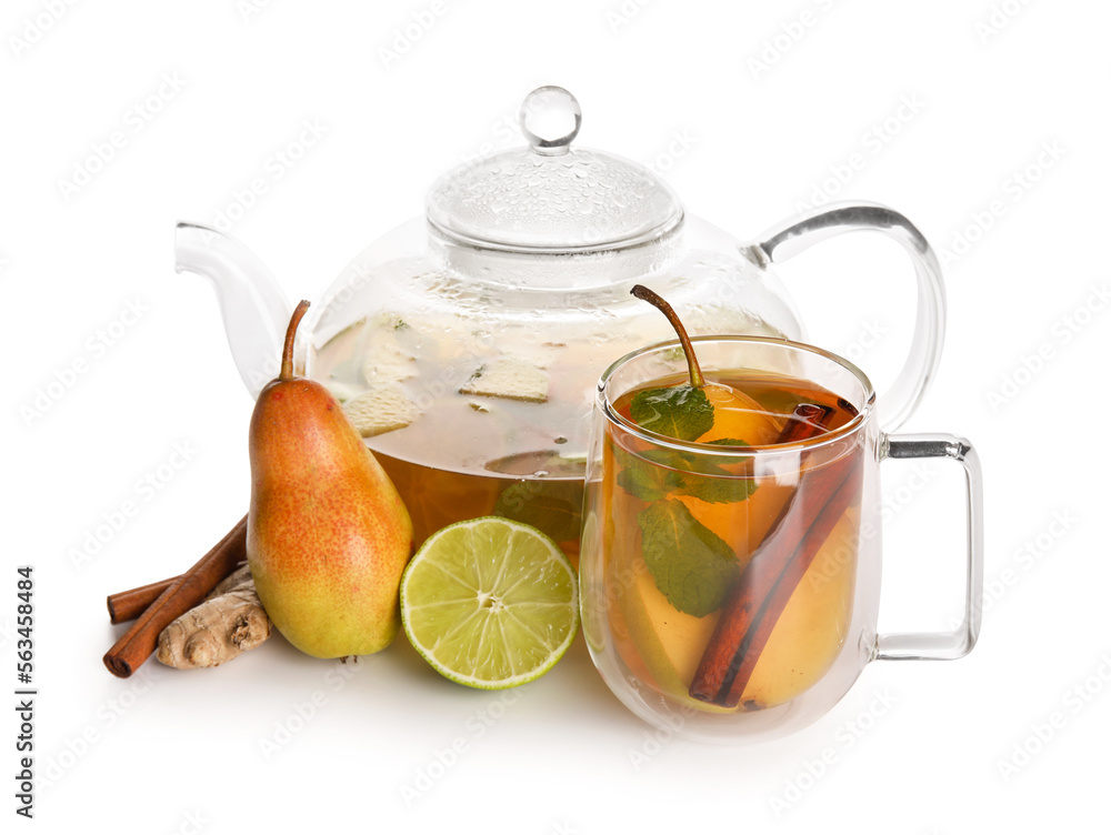 Glass cup of fruit tea with pear, cinnamon, lime, ginger and teapot on white background