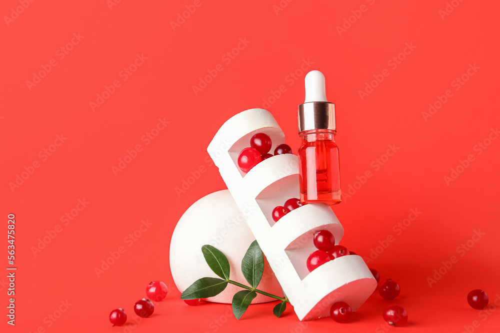 Composition with bottle of serum, cranberry and decor on color background