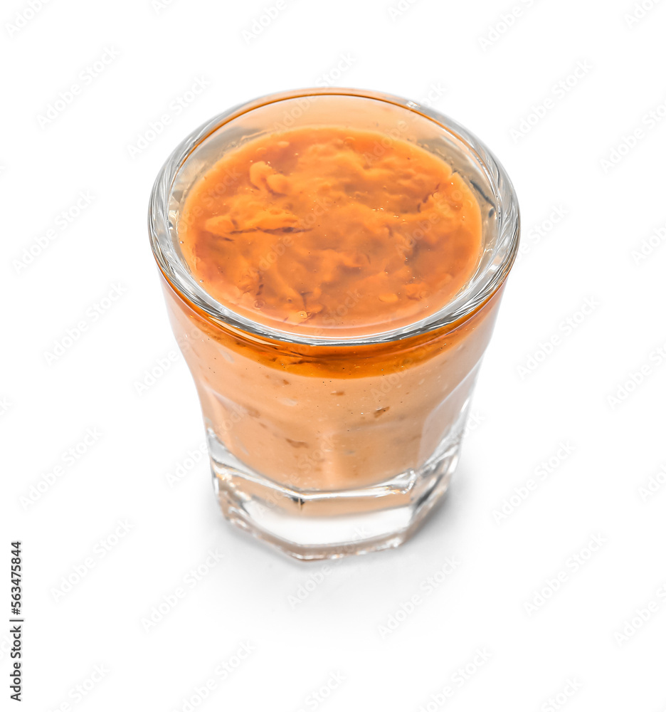 Shot of delicious pudding with jam isolated on white background