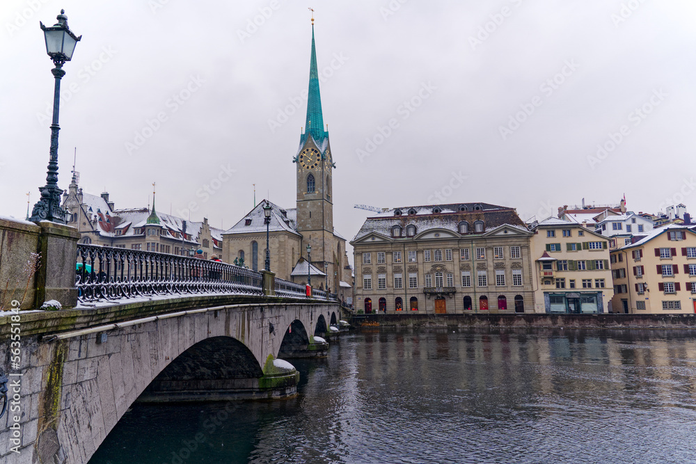 Beautiful cityscape of the old town of Zürich with protestant church Womens Minster, Minster Bridge