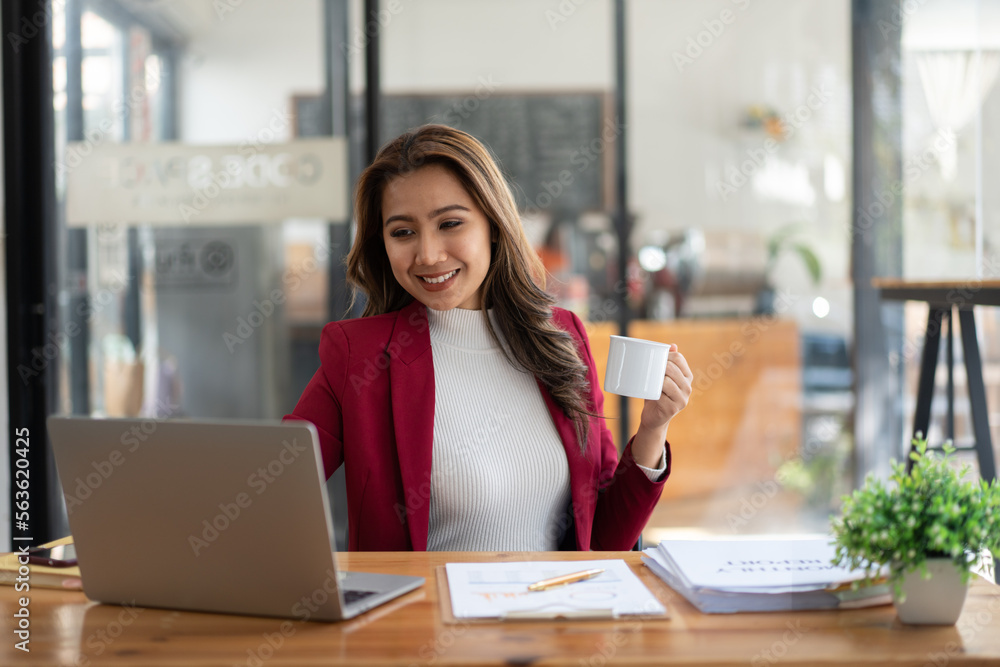 Young woman working with a laptop. Female freelancer connecting to internet via computer. Businesswo