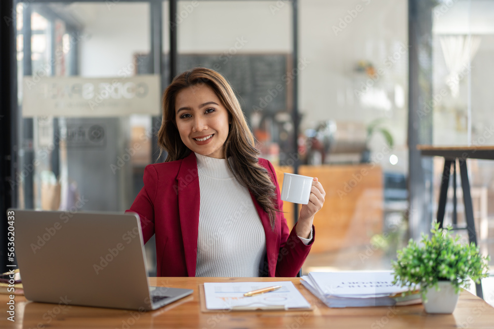 Young woman working with a laptop. Female freelancer connecting to internet via computer. Businesswo