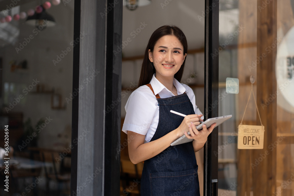 Opening a small business, Happy Asian woman in an apron standing near a bar counter coffee shop, Sma