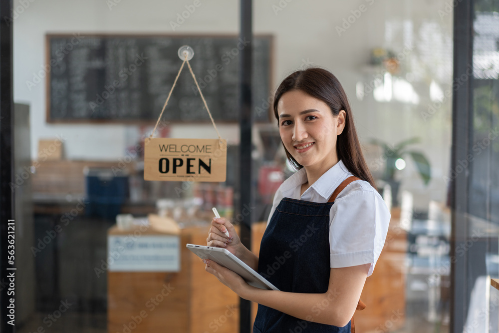 Opening a small business, Happy Asian woman in an apron standing near a bar counter coffee shop, Sma