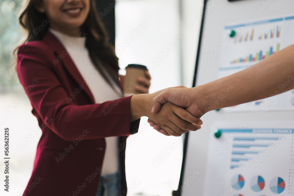 Partnership. two business people shaking hand after business job interview in meeting room at office