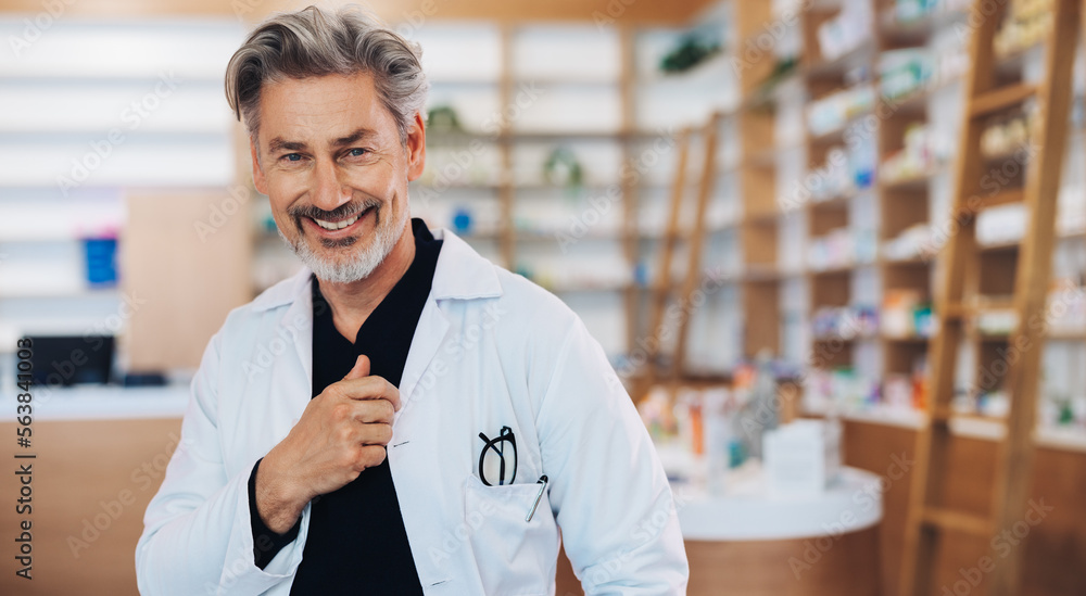 Senior doctor standing in a pharmacy