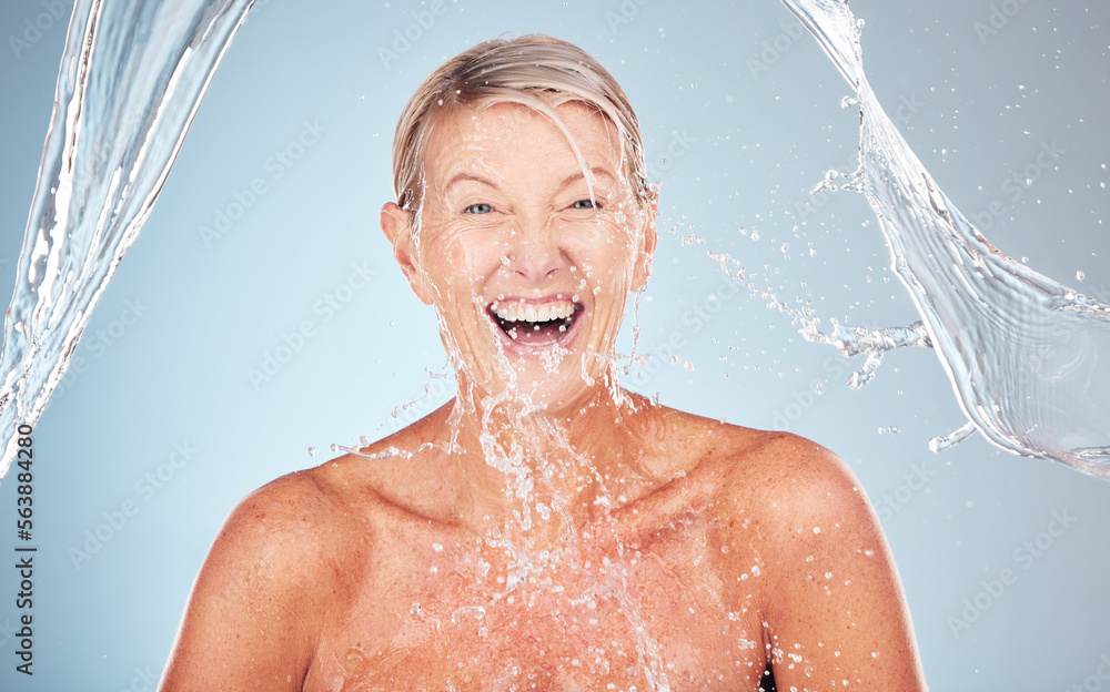 Skincare, senior and portrait of a woman with a water splash isolated on a blue background. Self car