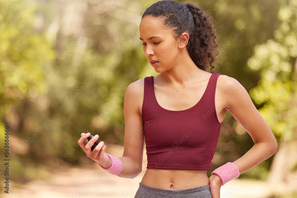 Fitness, woman and checking stop watch for running exercise, workout or training in the nature outdo