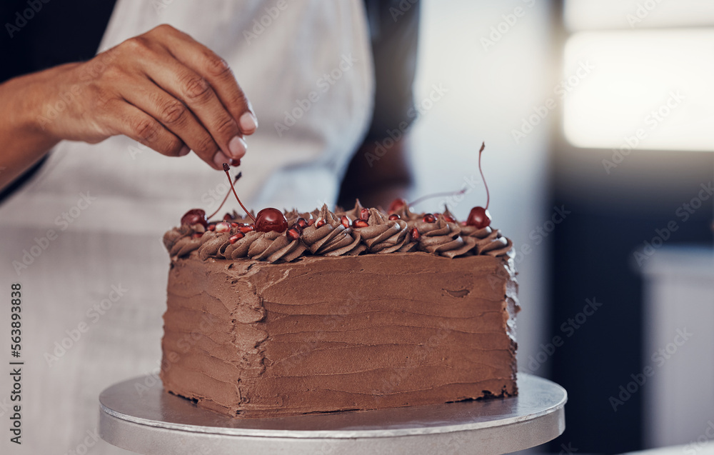 Hand, cake and food with a man chef working in a kitchen while preparing dessert for a party celebra