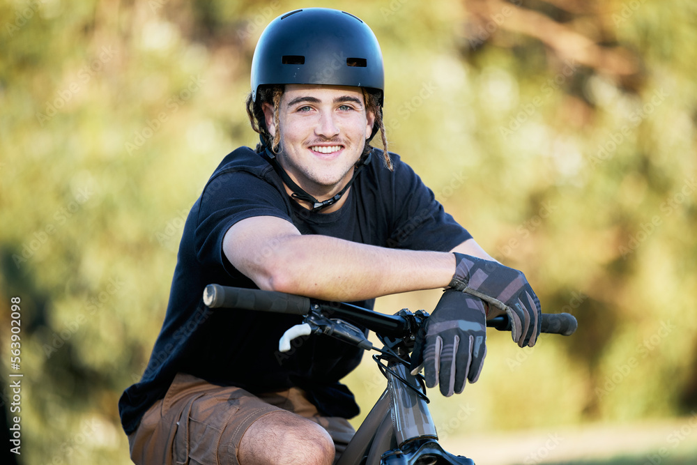 Portrait, bike and fitness with a sports man taking a break outdoor in nature during his trail ride.