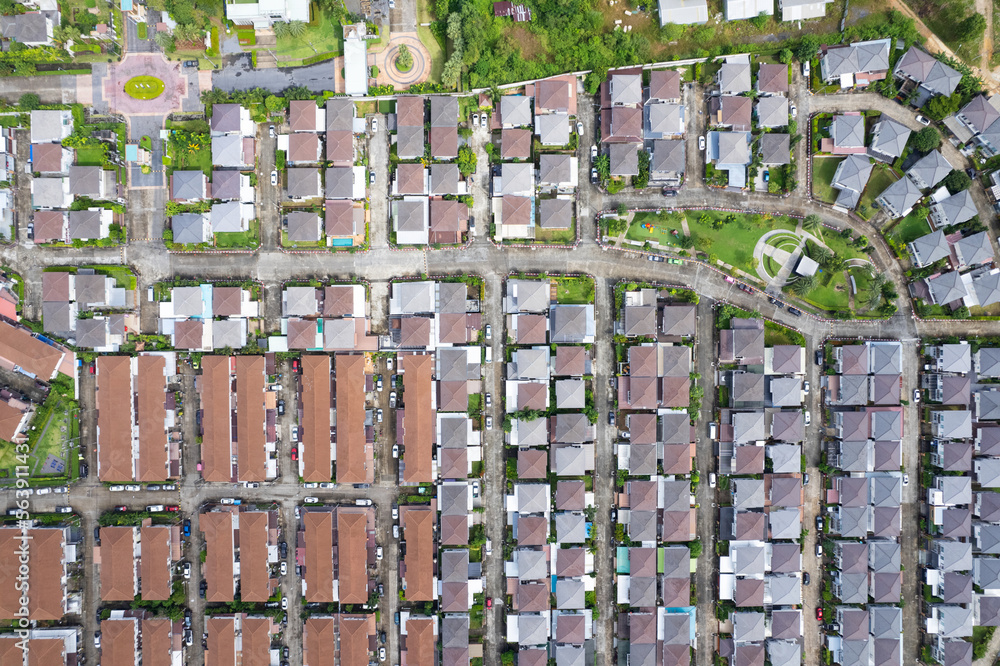 New development real estate. Aerial view of residential houses and driveways neighborhood during a f