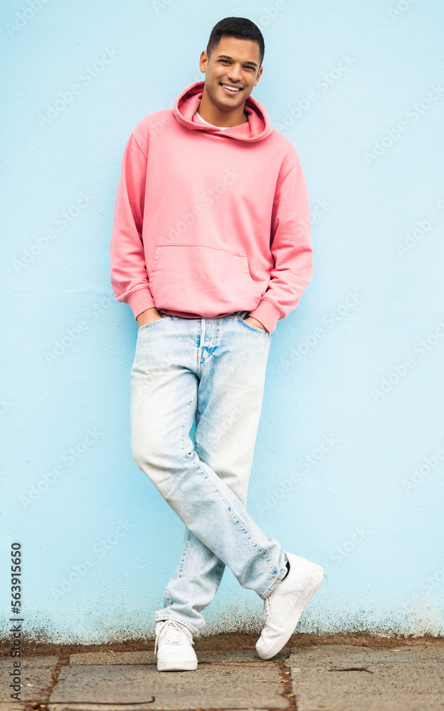 Man portrait, fashion clothes or leaning on isolated blue background in Brazil city for trendy or co