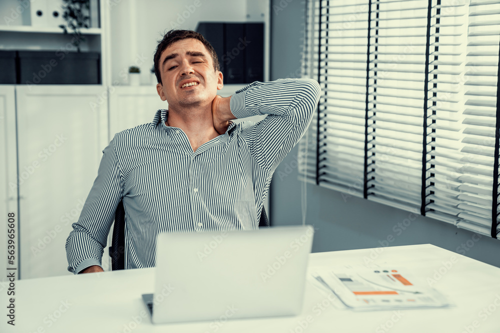 Competent office worker experiencing fatigue and neck pain. Unhealthy concept for office workers, of