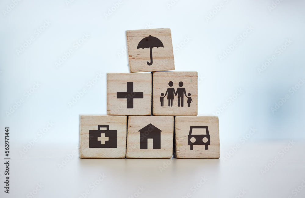 Building blocks, pyramid and life insurance for medical, car loan or home on background mockup, tabl