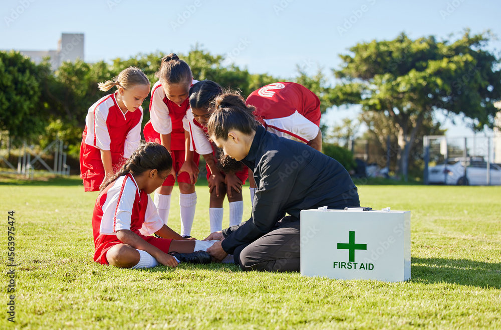 Sports, first aid and children soccer team with an injury after a game in a huddle helping a girl at