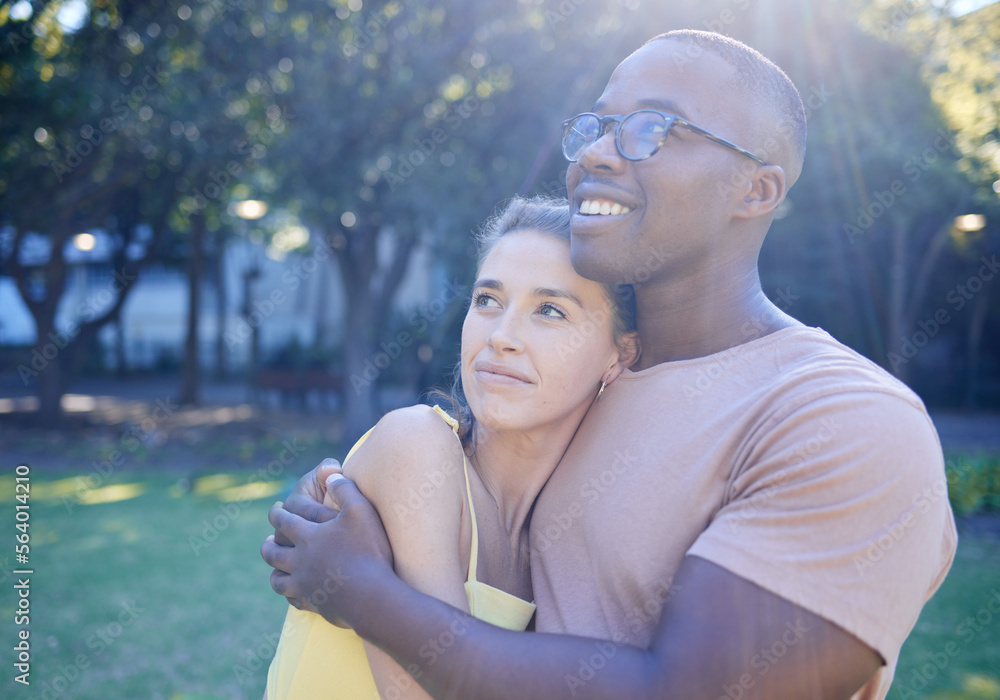 Interracial couple, hug and park with smile, thinking or love for bonding, together and vision of fu