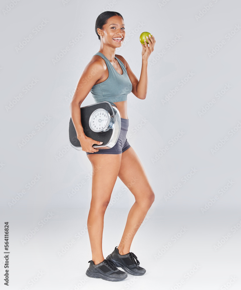 Apple, scale and body portrait of black woman on diet for health, weight loss and healthy workout li