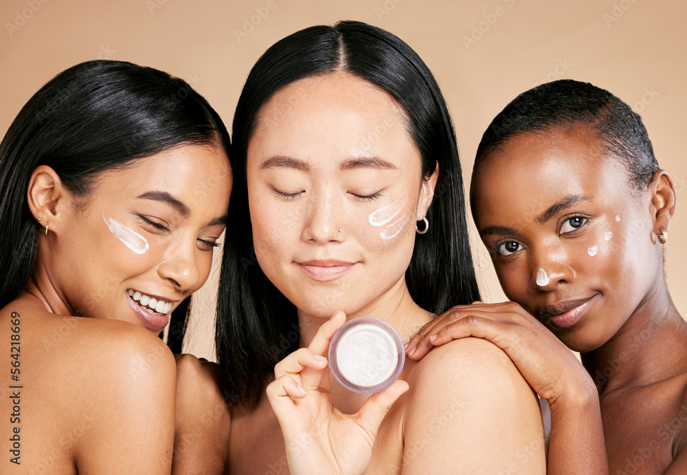 Diversity, face and cream product by women in studio for skincare, wellness and grooming on brown ba