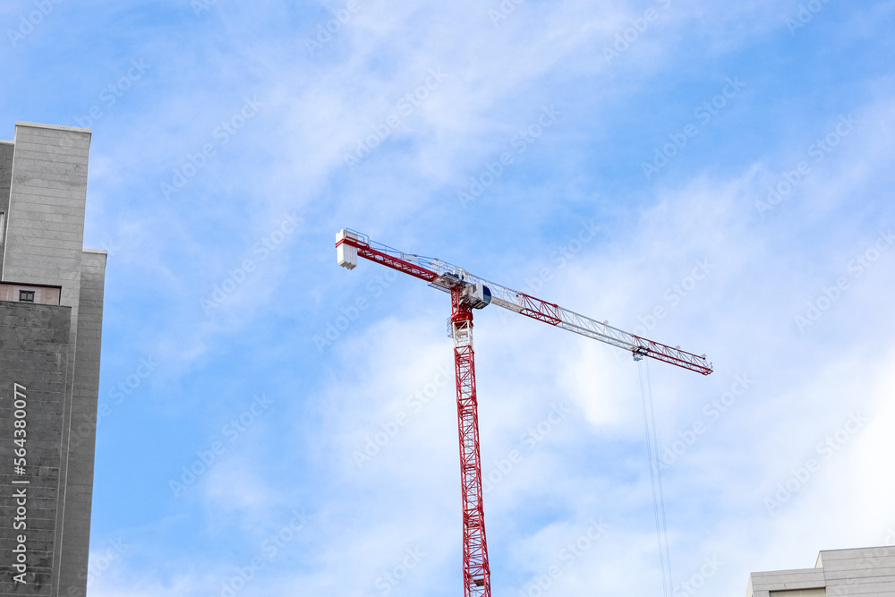 Construction crane against sky background