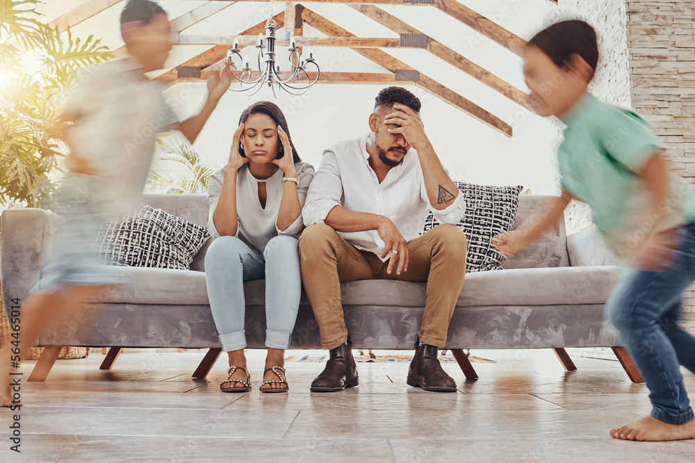 Tired parents, kids running and family in a living room feeling anxiety, headache and stress. Childr