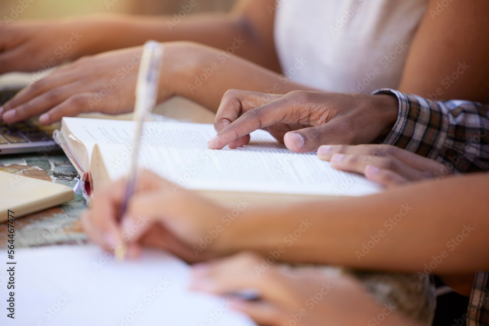 Students, education and hands writing in notebook for learning, exam studying and write notes in cla