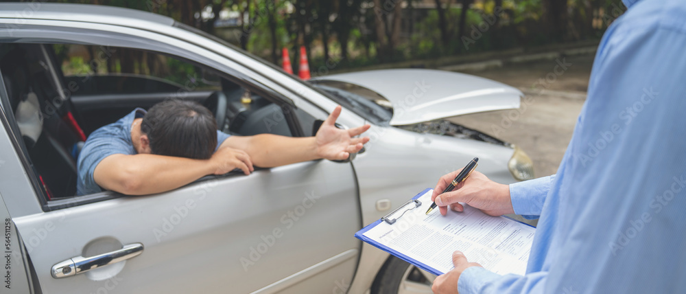 Insurance officer writing Insurance Claim Report on clipboard while insurance. Man and Insurance age