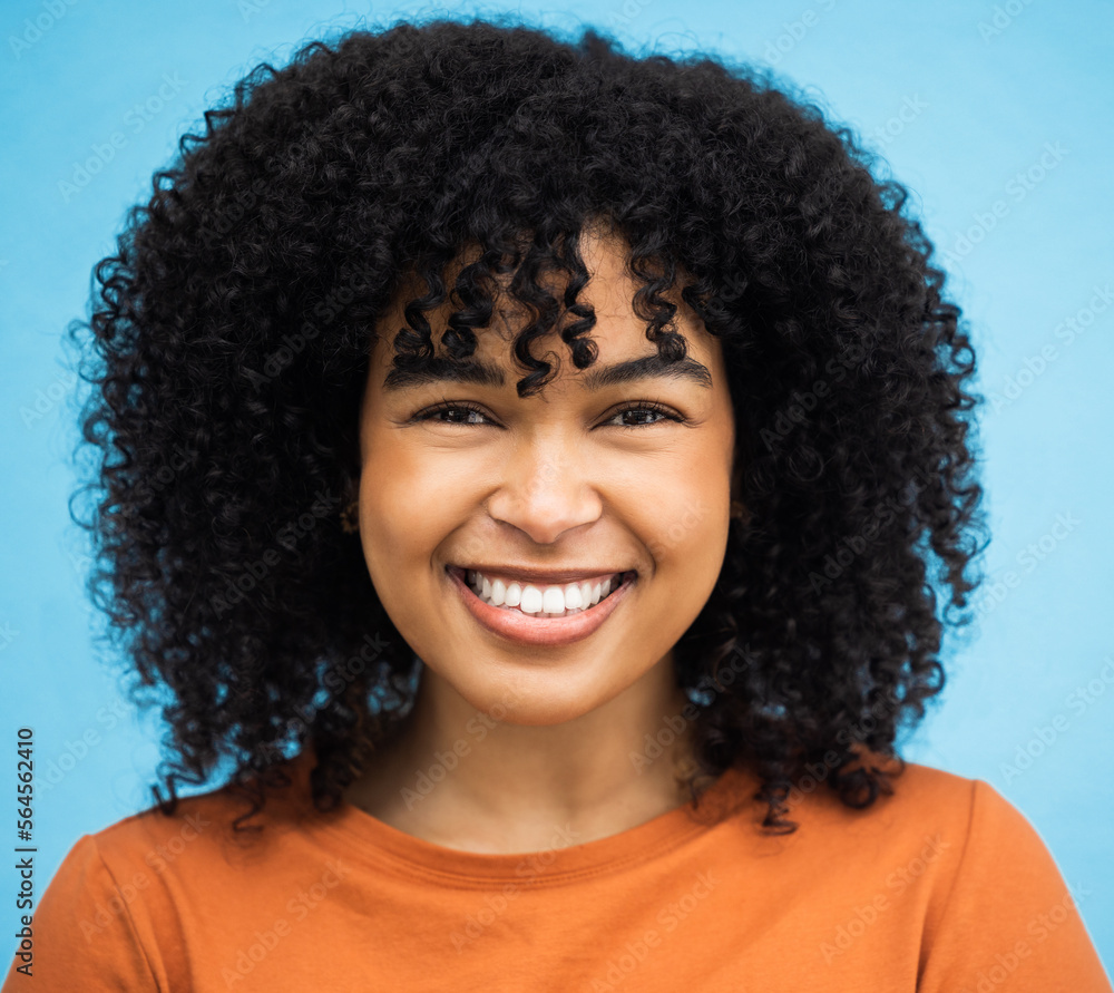 Happy, black woman or afro hairstyle portrait on isolated blue background in keratin treatment, self