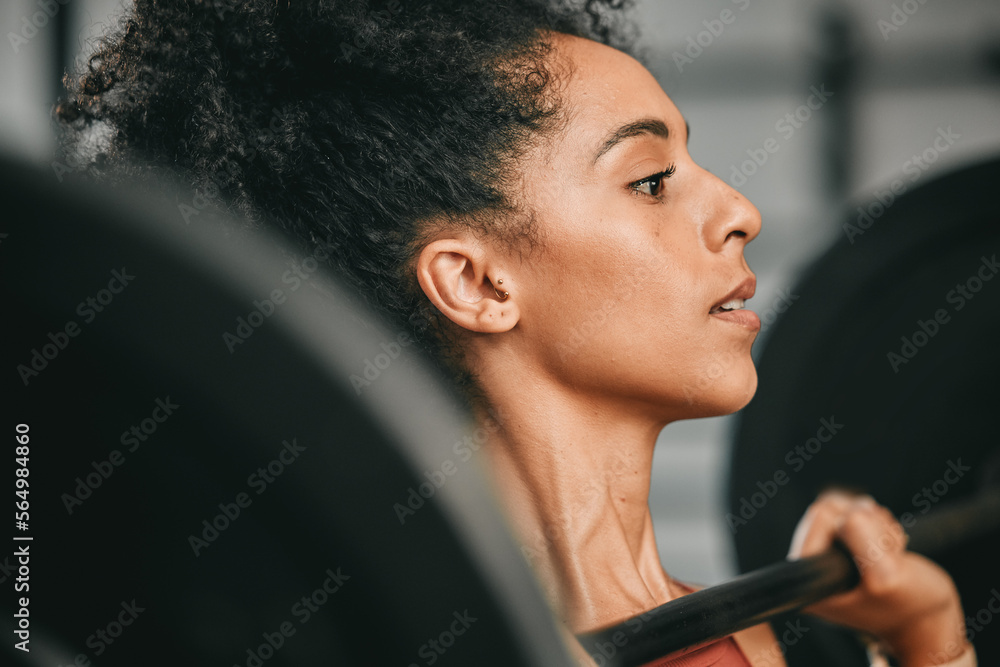 Gym face, barbell workout and black woman doing muscle fitness performance, strength training or bod