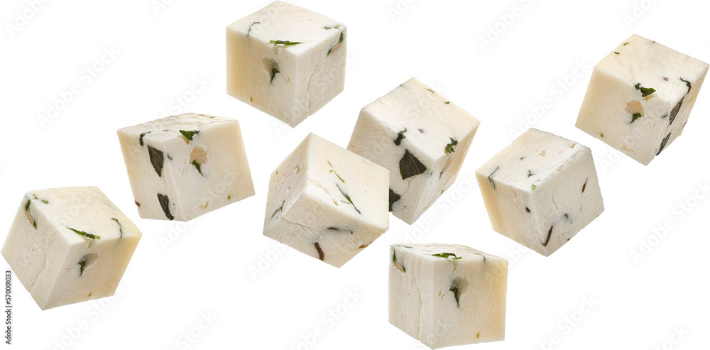 Falling feta cubes, diced curd cheese pieces with herbs and spices isolated