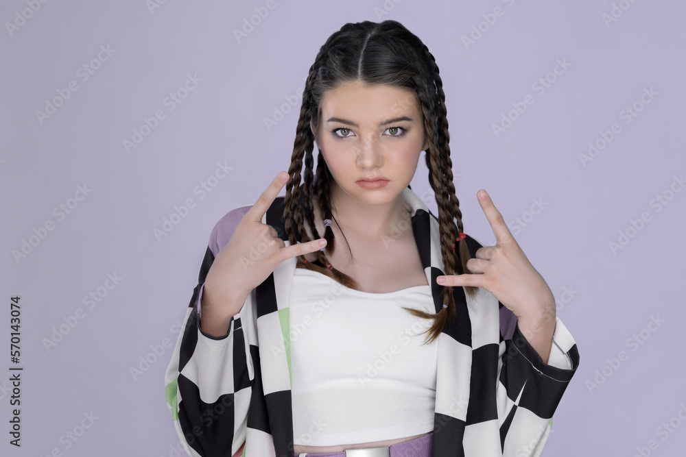 Closeup beautiful young girl with perfect skin, cosmetic and long braid posing with trendy fashion o