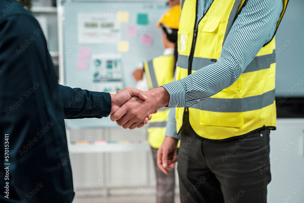 After concluding the meeting, competent investor shakes hands with engineer. Concept of the agreemen