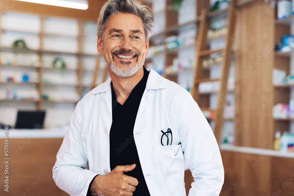 Male doctor standing in a chemist with a lab coat