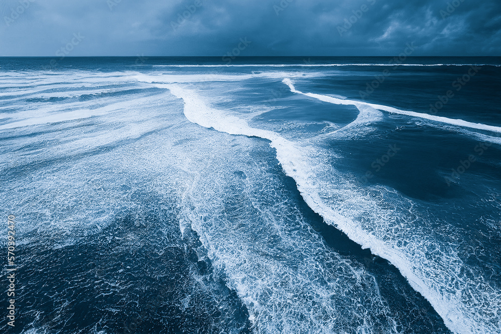 Spectacular aerial top view background photo of ocean sea water white wave splashing in the deep sea