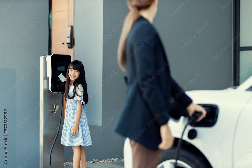 Progressive lifestyle of mother and daughter who have just returned from school in an electric vehic