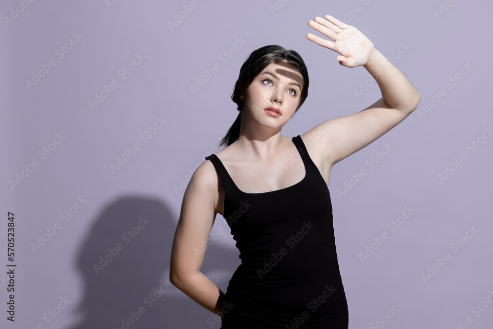 Young charming caucasian teenager girl with clean and fresh skin posing pointing fingers on empty ba